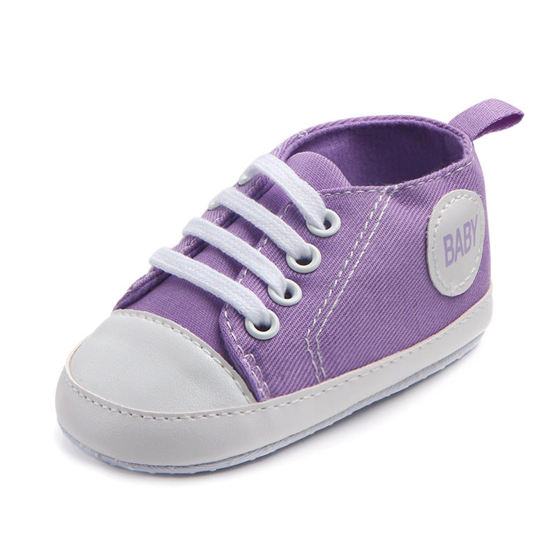 Soft-sole infant sneakers — lightweight, anti-slip shoes for first steps.