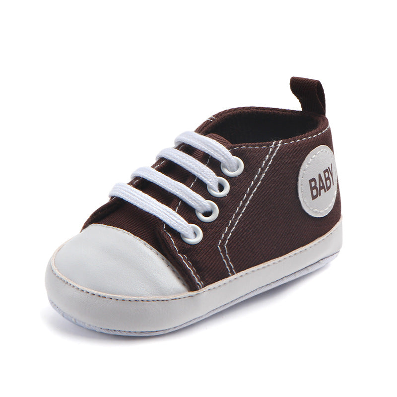 Soft-sole infant sneakers — lightweight, anti-slip shoes for first steps.