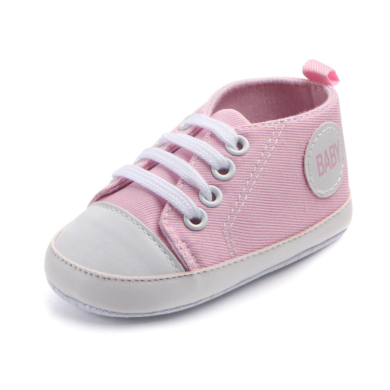 Soft-sole infant sneakers — lightweight, anti-slip shoes for first steps.