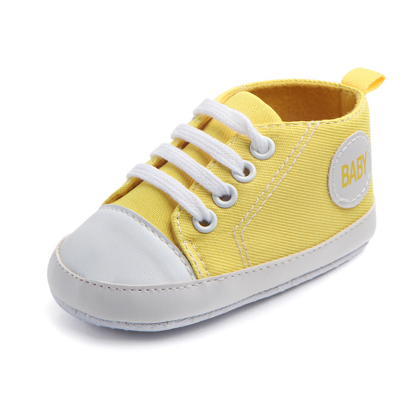 Soft-sole infant sneakers — lightweight, anti-slip shoes for first steps.